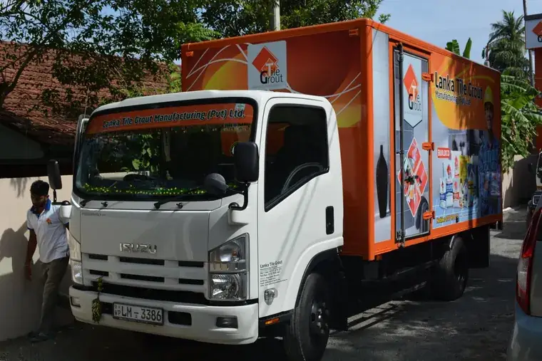 Lanka Tile Grout signboard with delivery fleet