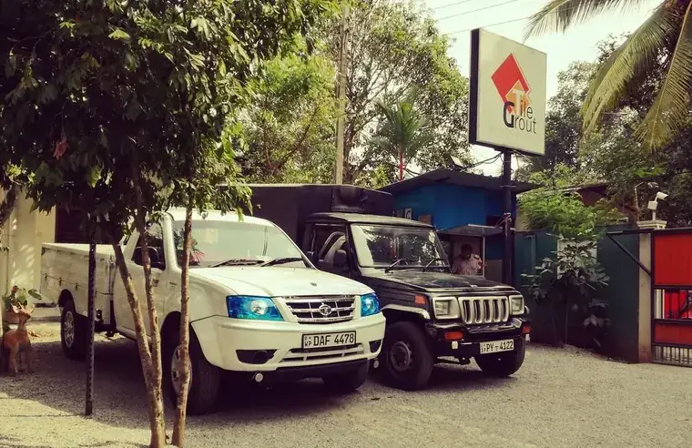 Lanka Tile Grout signboard with delivery vehicles